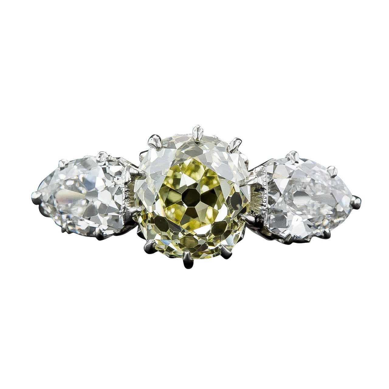 Edwardian 1.81 Carat Fancy Intense Yellow Diamond Platinum Three Stone Ring