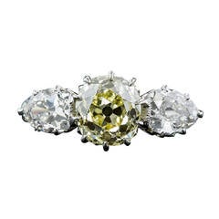 Antique Edwardian 1.81 Carat Fancy Intense Yellow Diamond Platinum Three Stone Ring