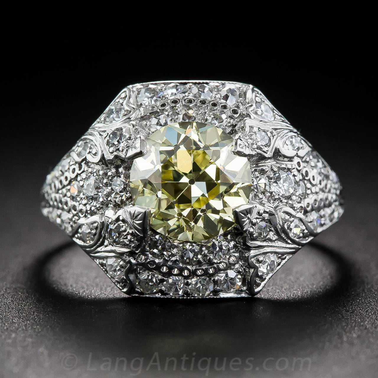 This spectacular Art Deco ring, circa 1920s-30s, showcases a sensational, sunshine bright, natural Fancy Yellow European-cut diamond, weighing 1.76 carat. We've owned and examined many Fancy Yellow and Fancy Intense Yellow diamonds over the years