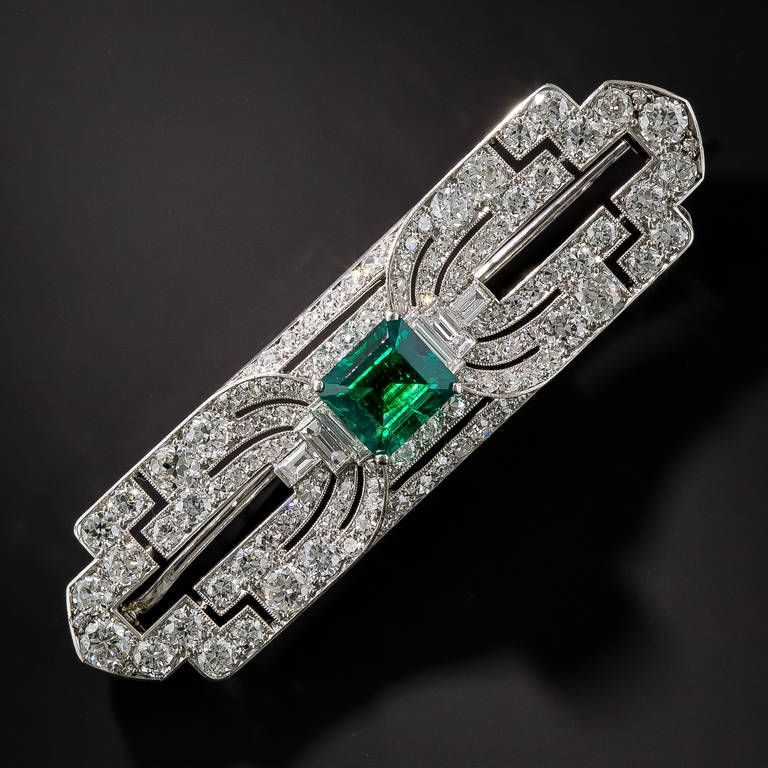 In addition to the streamlined geometric styling, fine Art Deco jewels of the 1920s-30s are noted for their superior gemstones, and here is a splendid case in point. This majestic platinum and diamond brooch showcases a truly magnificent, old mine