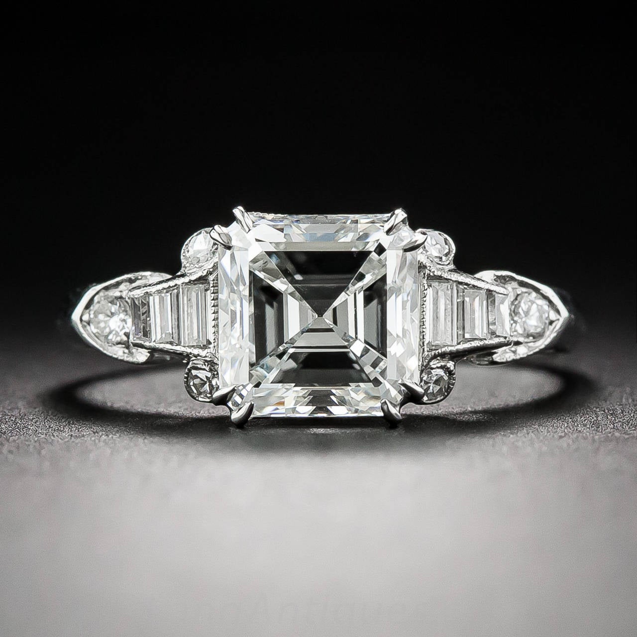 A radiant and ravishing, bright white square-cut diamond, weighing just a couple points shy of 2 carats, and accompanied by a GIA Diamond Grading Report stating: G color - VS2 clarity, is presented in consummate, sophisticated Art Deco glory between