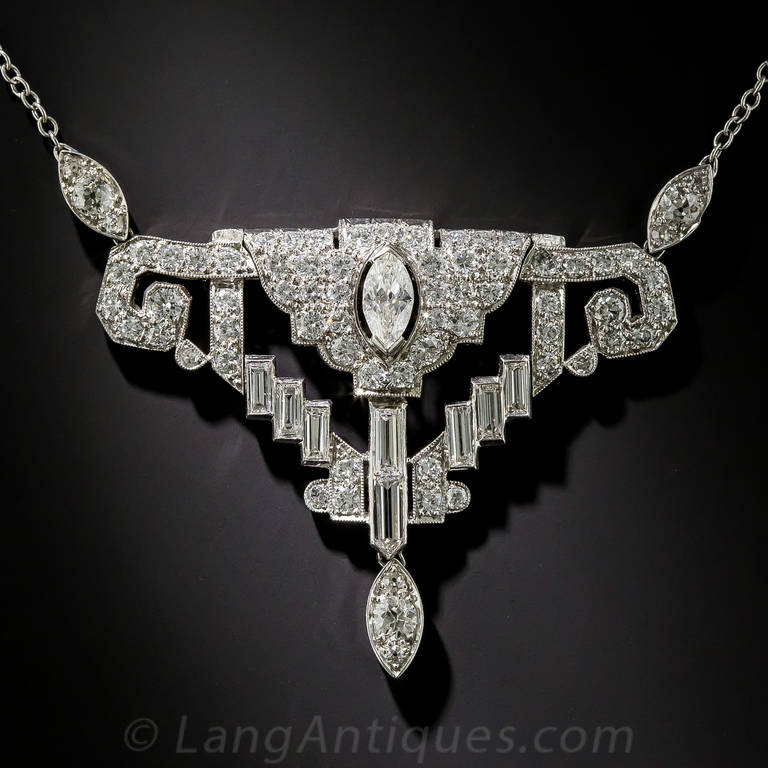 An artful, geometric assemblage of fine baguette, marquise, round brilliant and bullet-shaped diamonds, totaling 5.00 carats, coalesce in this chic and sophisticated platinum necklace created during the second half of the last century in faithful