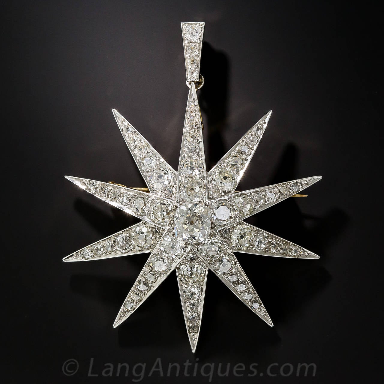 This late-19th century diamond star brooch/pendant is undoubtedly one of the most glorious and impressive examples of this motif we have ever had in our collection. Hand fabricated in platinum over 18K yellow gold, the 10 rays of this blazing