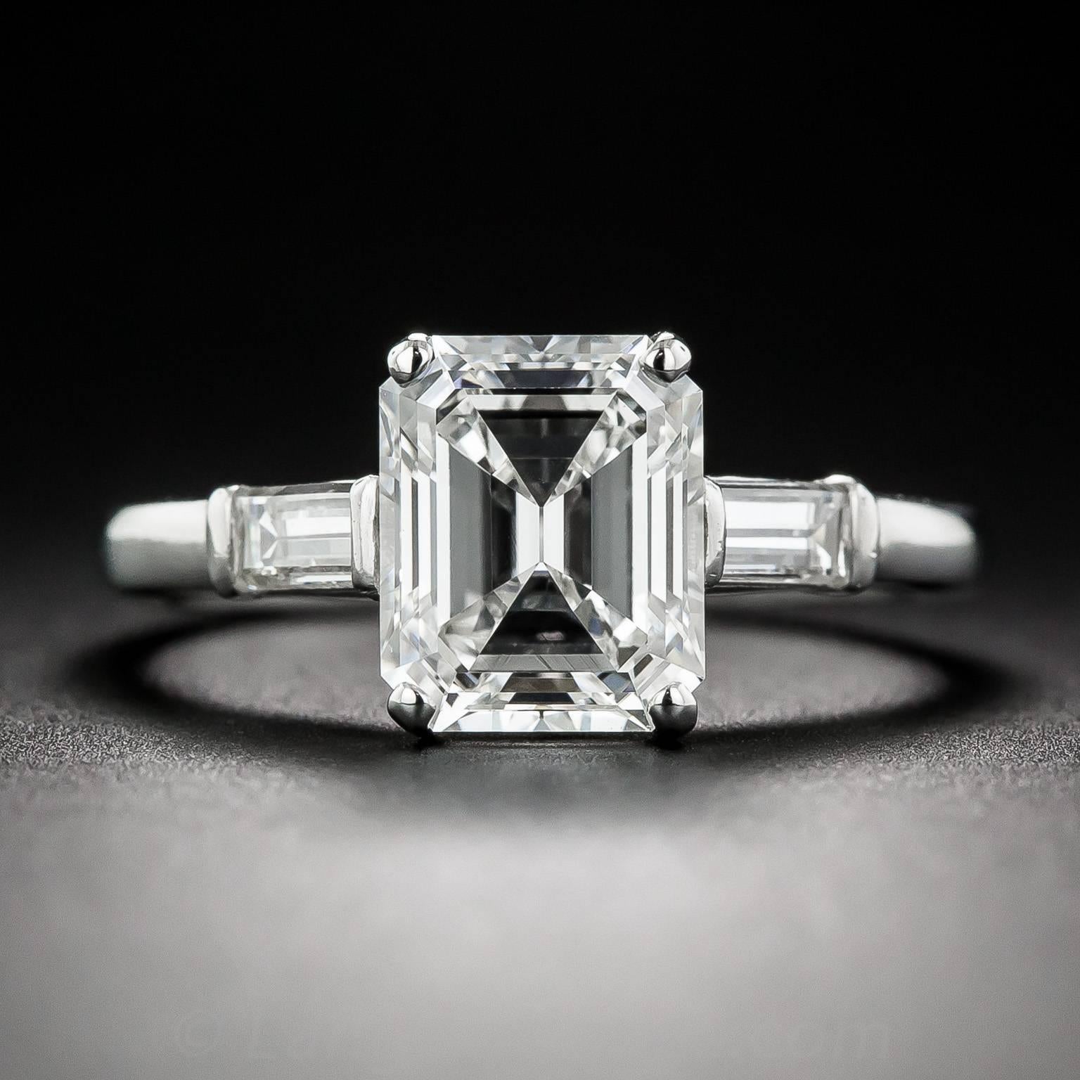 Understated elegance shines brightly in this signed Raymond Yard platinum engagement ring featuring a stunning emerald-cut diamond, weighing 2.21 carats, with exceptional F color and VS1 clarity. Raymond Yard aimed for timeless, classic style in his