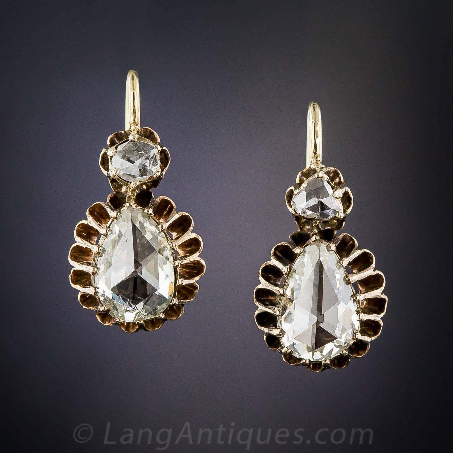 Rare, radiant and absolutely ravishing, original rose-cut diamond earrings, dating from the latter-19th century, highlighting an exceptional pair of pear shape diamonds, totaling approximately 2.30 carats. The scintillating stones are presented in