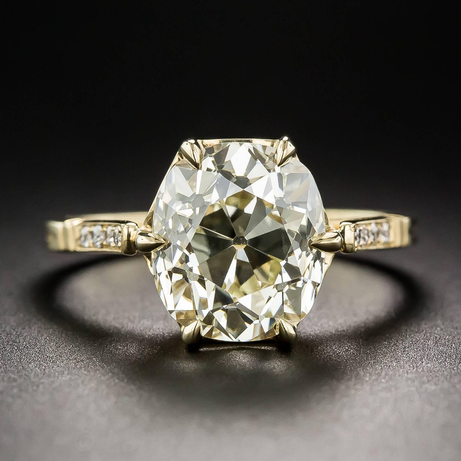 A gorgeous, original, antique cushion-cut diamond, weighing 4.10 carats, cut during the 1920s-30s, has found a new home in an elegantly understated mounting, hand-fabricated in 18K yellow gold to meld with the sunshiny tinge of the diamond. The