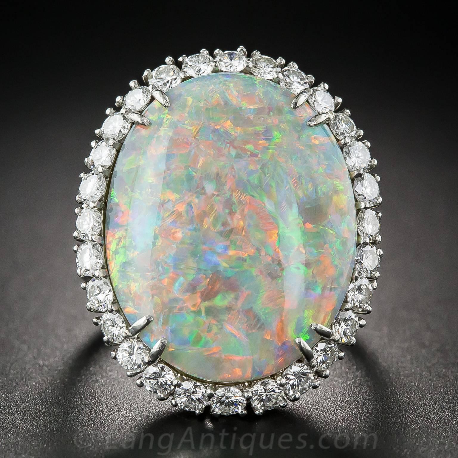 This fabulous, large-scale opal just screams "wear me, show me!" Every movement, every turn, brings out more colors and life in this enchanting and engaging gemstone. A kaleidoscopic play of color in orange and pink, yellow, blue and green