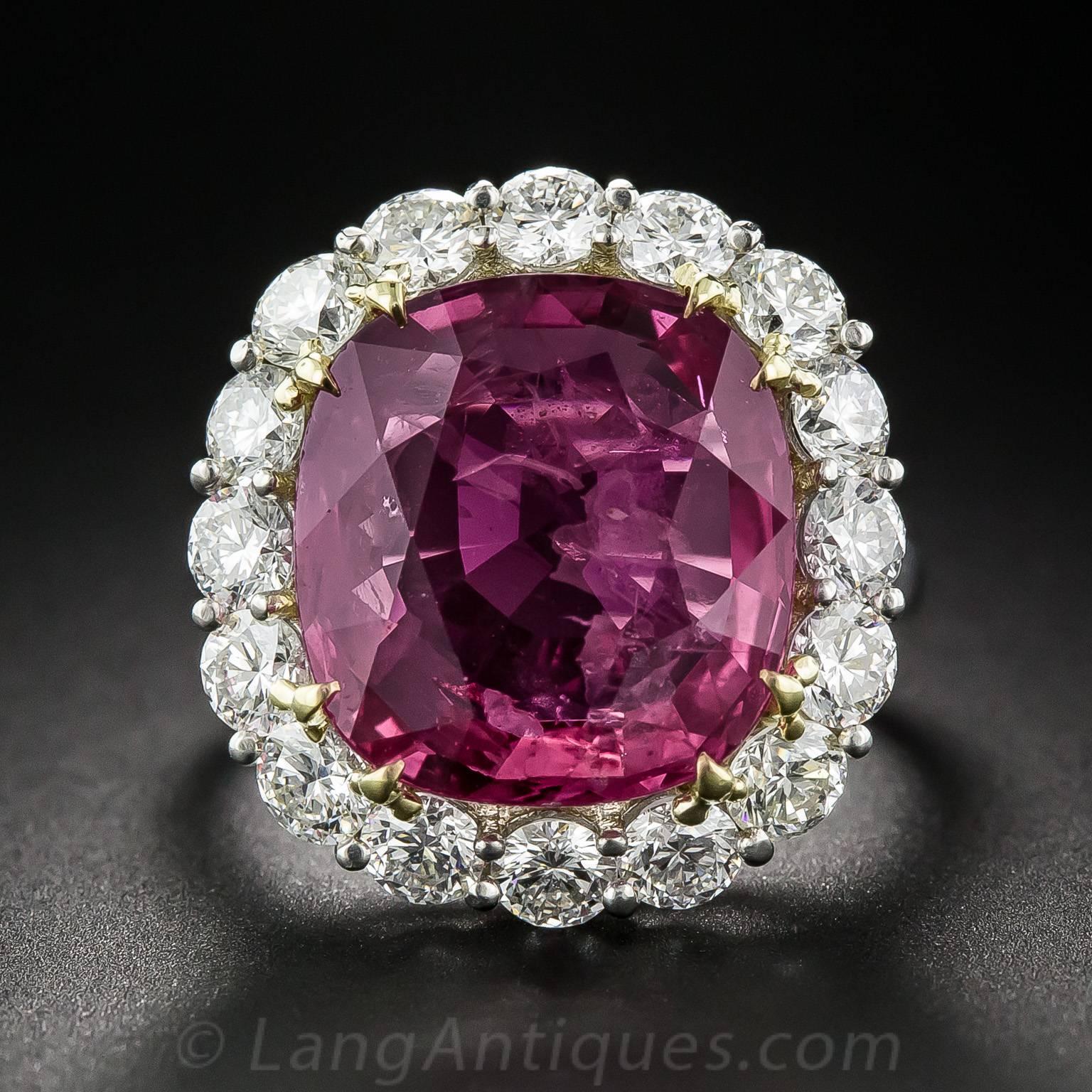 Although weighing in at an impressive 9.82 carats, the relatively shallow cut of this enchanting raspberry red Thai ruby makes it look closer to a 20 carat stone.  The beautiful and impressive gemstone is classically presented in platinum, set with
