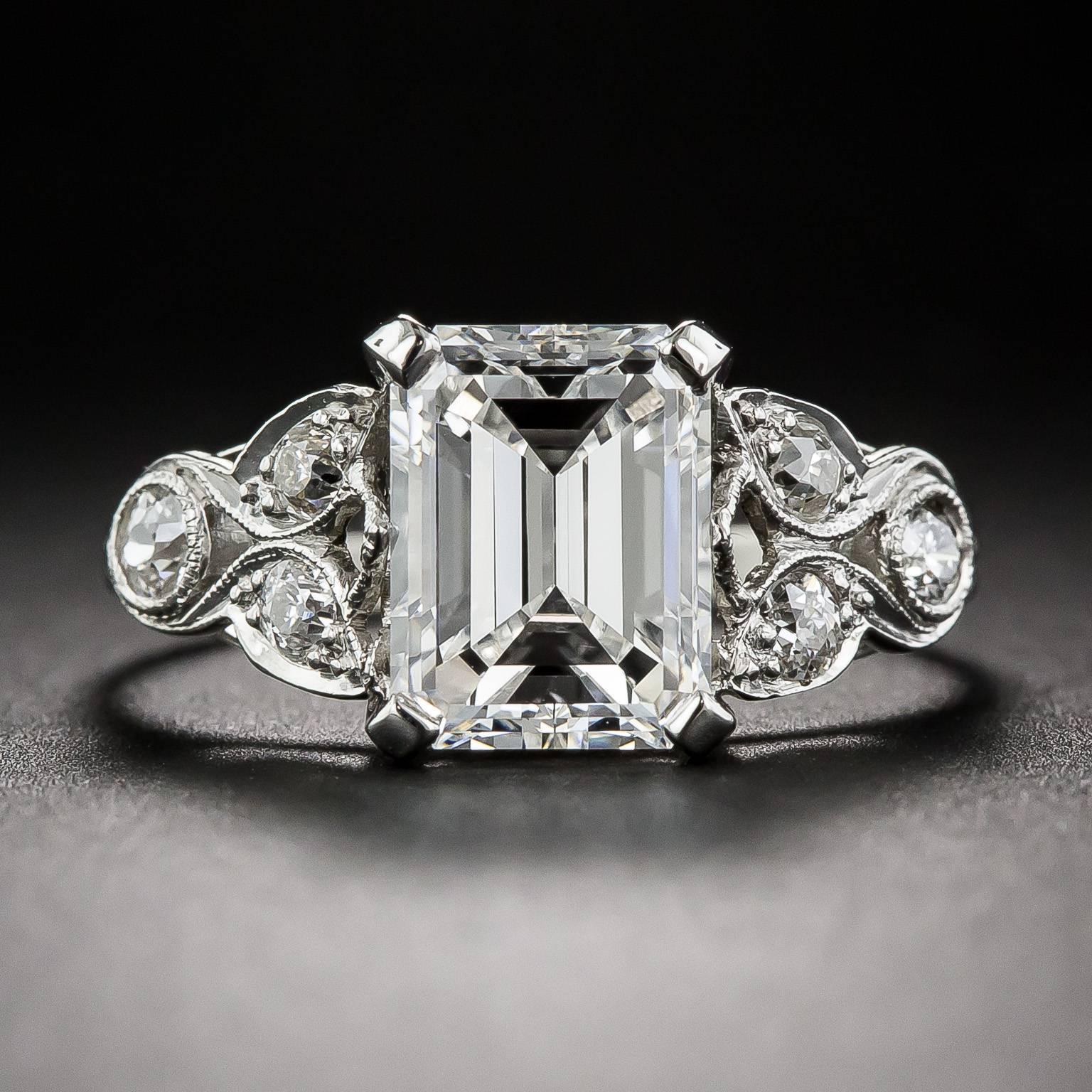 An absolutely dreamy, original - circa 1920 - Art Deco engagement ring featuring a bright white and stunning 2.03 carat emerald-cut diamond with a GIA Diamond Grading Report stating G color and VS1 clarity. The radiant rock is showcased in an