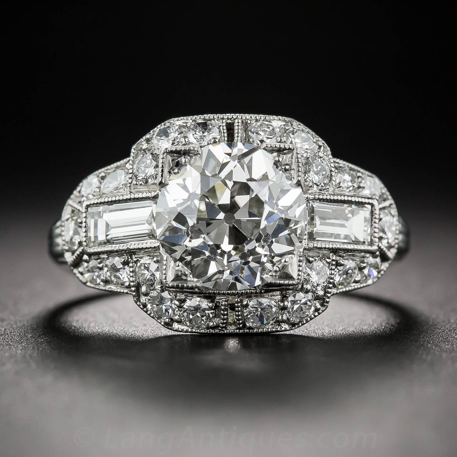 A stunning, original Art Deco 'cigar band' ring, circa 1930, sparkling front and center with a bright white and beautiful European-cut diamond, weighing 2.11 carats. Presented in platinum, the center stone is embellished all around with small