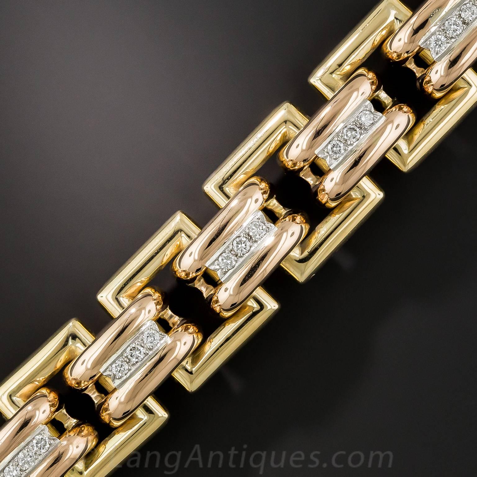 This big, bold, gleaming gold Retro wrist bauble, clocking in at an impressive 5 ounces, is substantially crafted in tri-color 18K gold: yellow gold outer links, rose gold inner links, and white gold to accentuate the center row bright-white