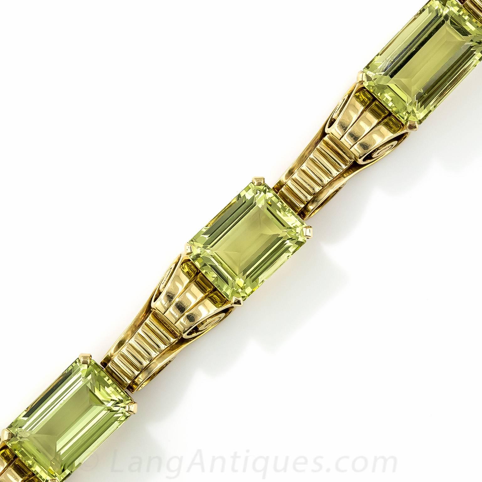 A ravishing rarity by America's foremost jeweler, Tiffany & Company - circa 1940s. This chic, boldly styled Retro bracelet glistens and glows with four emerald-cut beryls of an enchanting yellowish-green hue. Green Beryl is the same gemstone as