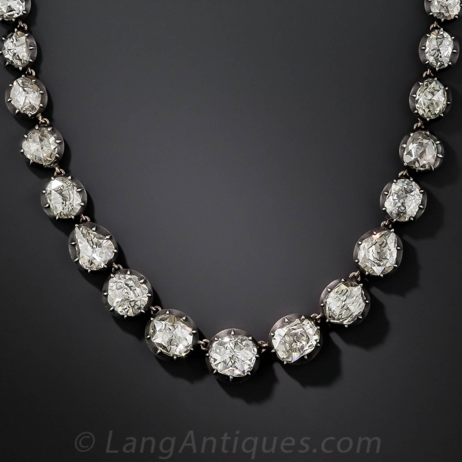 A truly extraordinary, high-quality, nineteenth century Rivière necklace, crafted in darkened silver over rosy-yellow gold, glistening all around, by starlight or candlelight, with a total of 20 carats of bright-white, beautifully cut, high-quality