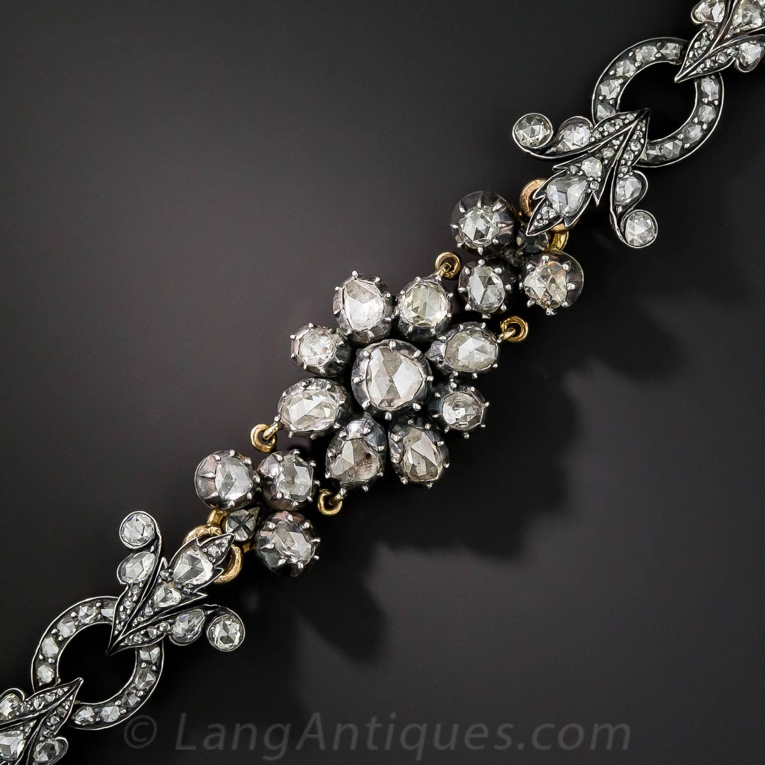 This romantic rose-cut rarity glistens and glows by sunlight or candlelight (as when it was made), with over 10 carats of brightly scintillating rose-cut diamonds. Handcrafted in darkened silver over 18K gold, this ravishing bracelet was imported