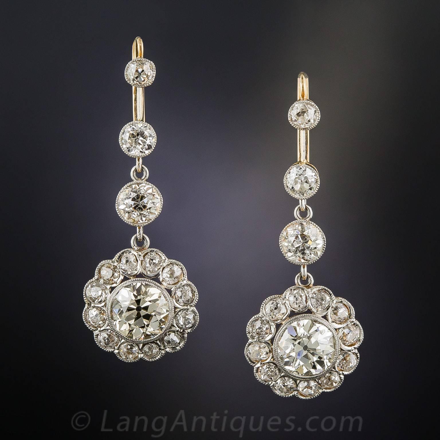 Swinging ultra-sparklers! Dating back to the early-1920s, these fabulous 1 1/2 inch long and lustrous diamond drops radiate front and center with a matched pair of gorgeous European-cut diamonds, together weighing 3.75 carats. The stones scintillate