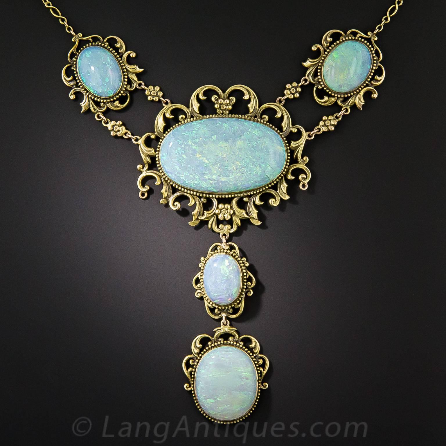 Five sizable multi-colored pastel opals (plus one more at the clasp), together weighing approximately 34 carats, are presented in regal fashion in this opulent and enchanting necklace dating from the-turn-of-the-last-century. The captivating