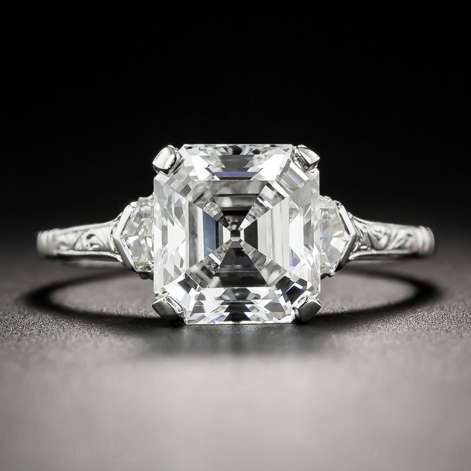 Behold! This bright icy-white, ultra-sparkling vintage emerald-cut (a.k.a. Asscher-cut) diamond beaming between a pair of fancy step-cut pentagonal epaulet diamonds. The scintillating 2.91 carat stone is accompanied by a GIA Diamond Grading Report