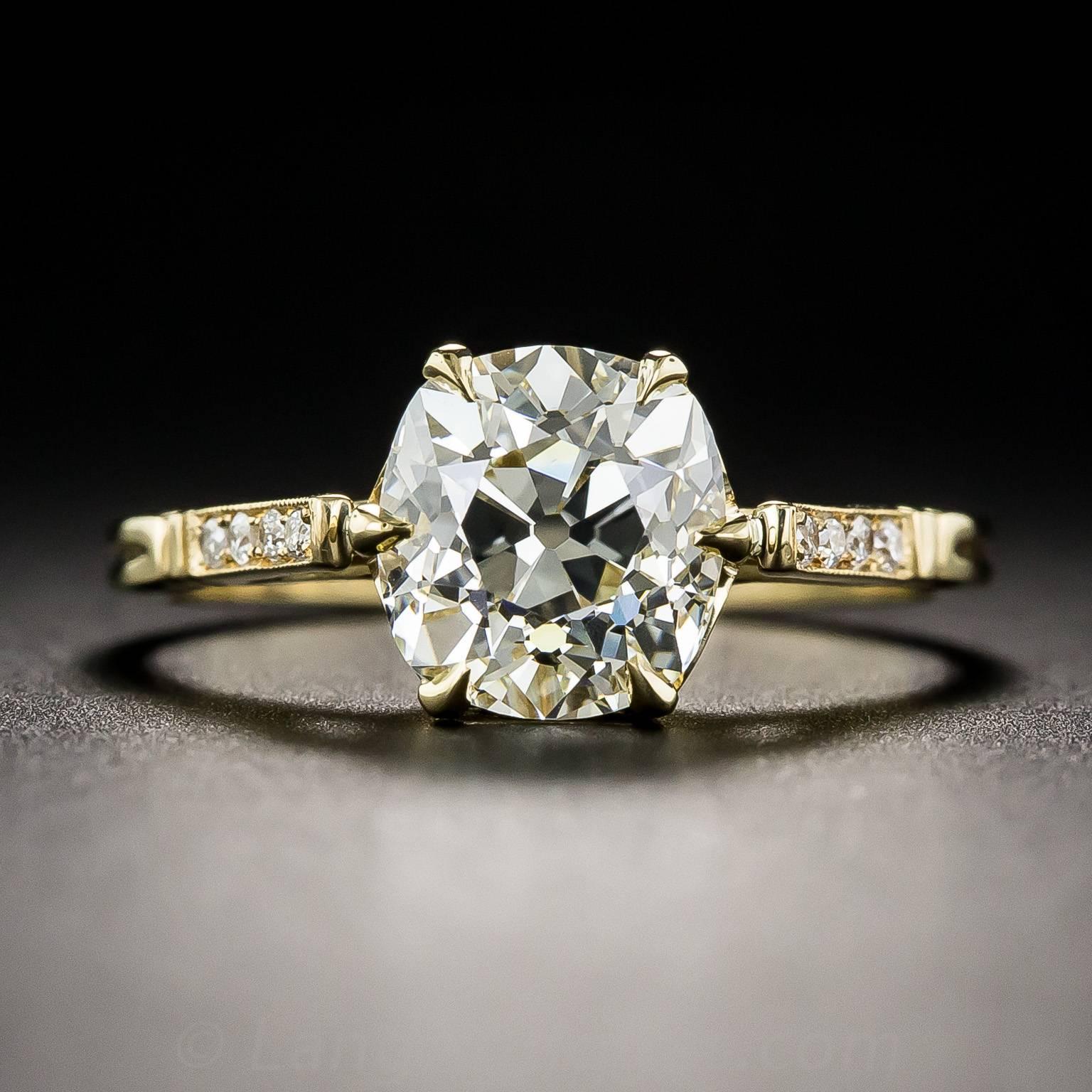 We commissioned our expert jeweler to fashion a new mounting for this gorgeous, radiant, 2.33 carat antique cushion-cut diamond to replace the worn out original. However, instead of platinum, we chose 18K gold to compliment the warm glow and sizzle