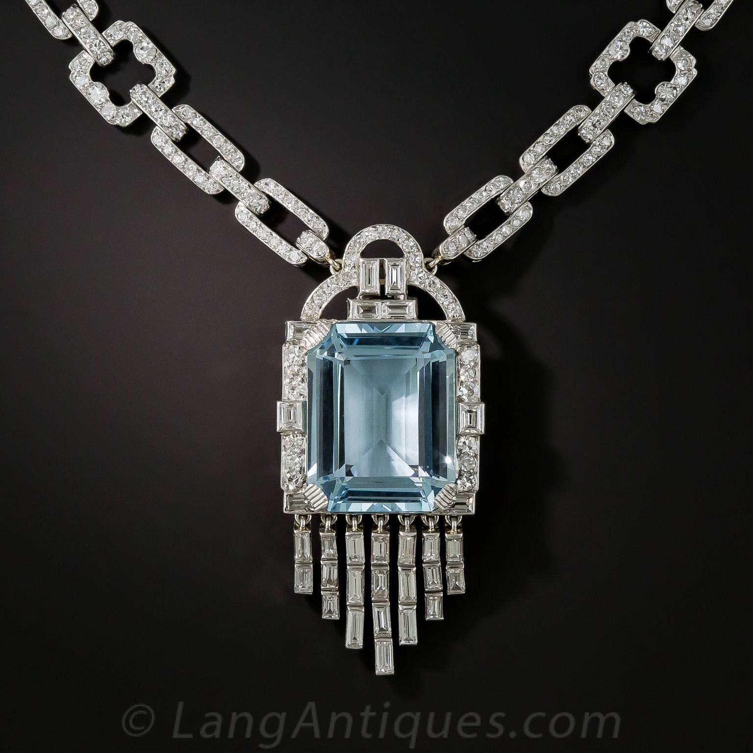 A rare, radiant and ravishing Art Deco necklace, circa 1930, by the eminent Madrid, Paris and London joaillier - Lacloche Frères - starring a placid pastel blue aquamarine gemstone, weighing 18.51 carats. The lovely emerald-cut aqua centers a