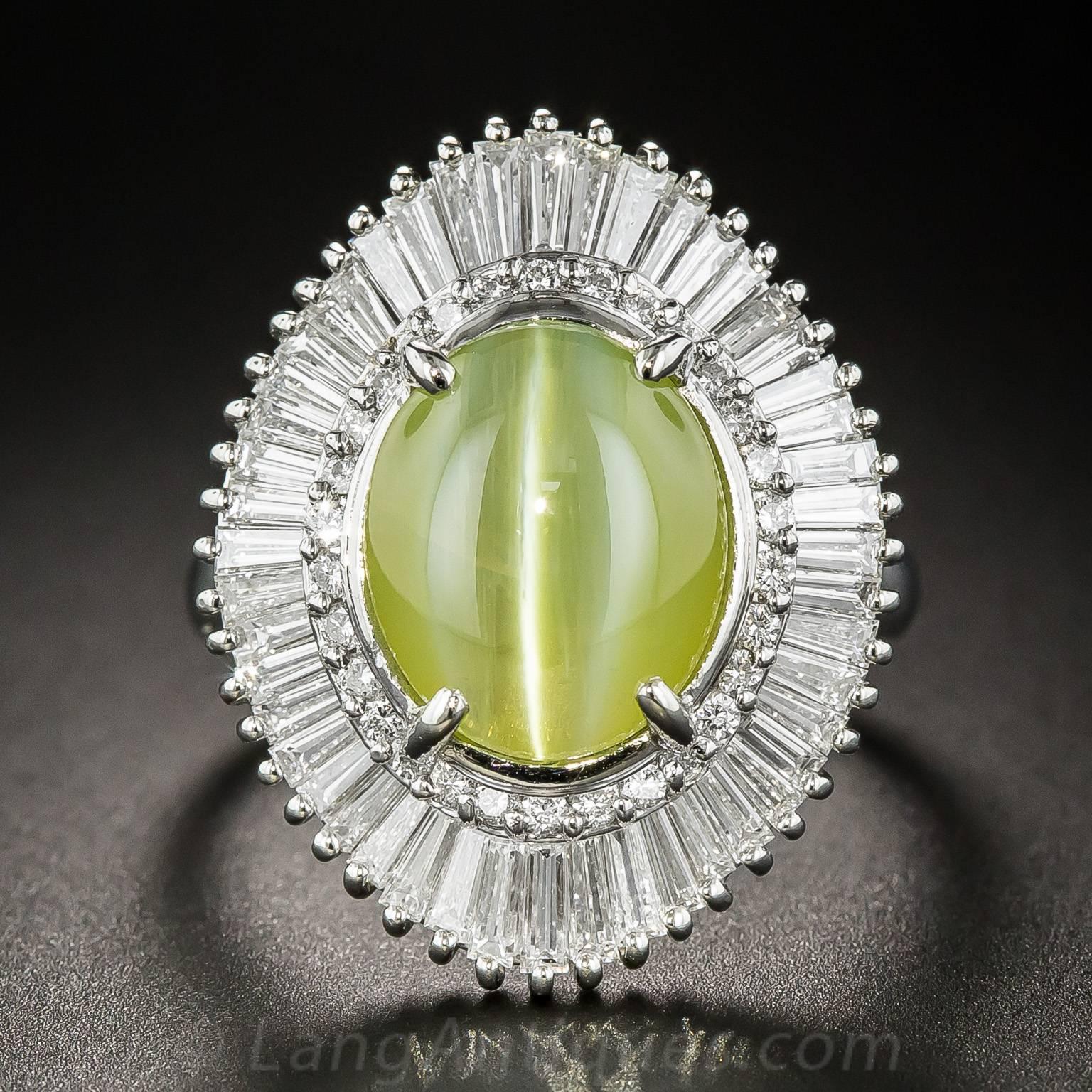 A crystalline, luminous and mesmerizing gemstone, a 7.55 carat chrysoberyl cat's-eye imbued with a sweet greenish honey color and exemplary chatoyancy (the sharp white cat's-eye) winks at you night and day from the center of a gorgeous ballerina