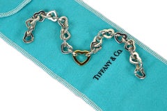 Tiffany & Co. Bracelet « Cœurs ouverts » en argent sterling et or jaune 18 carats, fabriqué en Italie