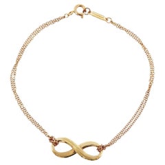 Bracciale TIFFANY & Co. con doppia catena “Infinity” in oro giallo 18 carati, misura 6,5"