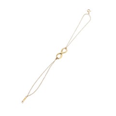Bracciale TIFFANY & Co. con doppia catena “Infinity” in oro giallo 18 carati, misura 6,5"