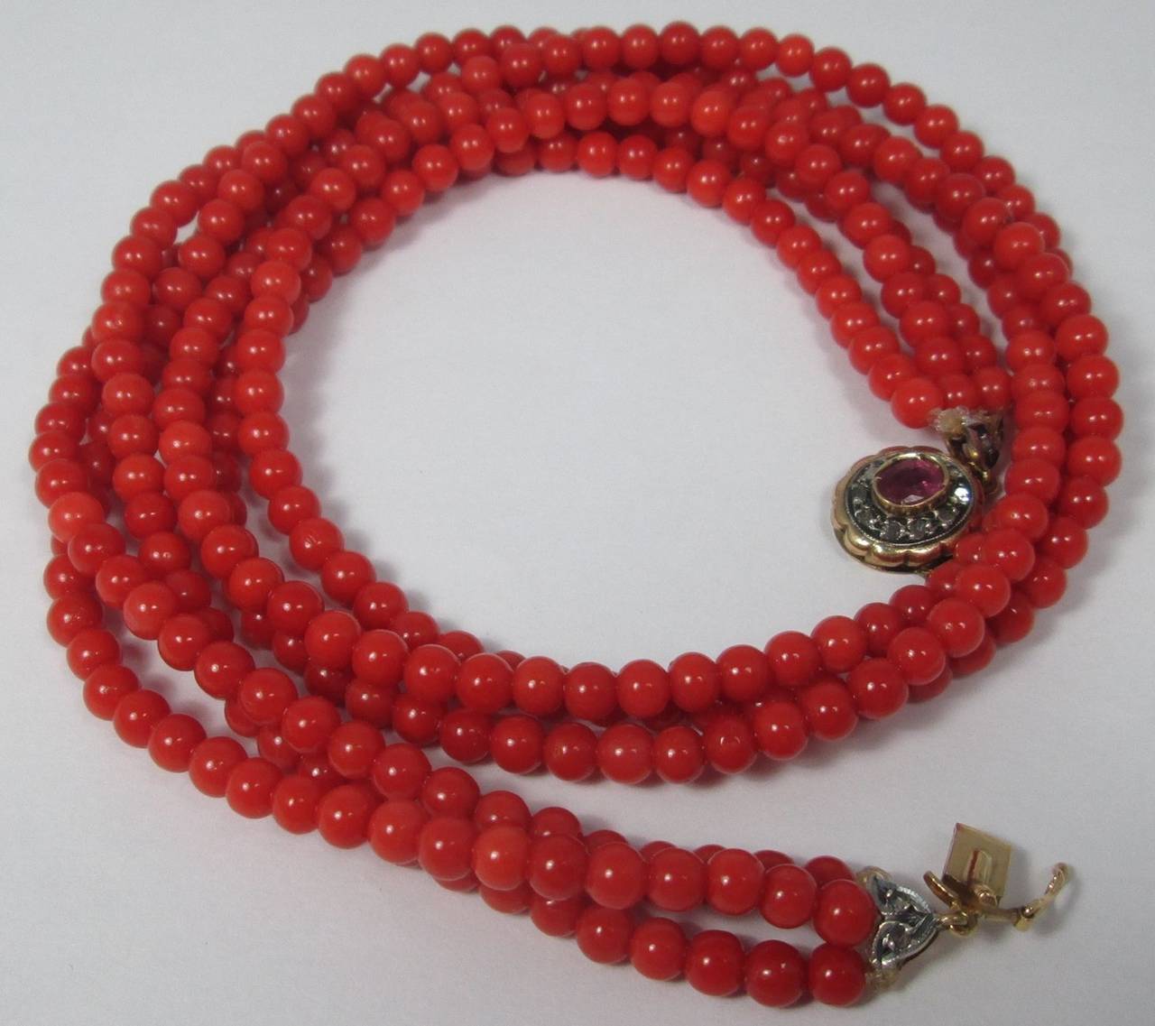 Composed of  coral beads, measuring approximately 5 mm corallium rubrum round smooth bead with 18kt gold rose diamond and pink tourmaline

Weight: 54.4 gr

Lenght: 49 cm

PLEASE NOTE: OUR PRICE IS FULLY INCLUSIVE OF SHIPPING, IMPORTATION TAXES