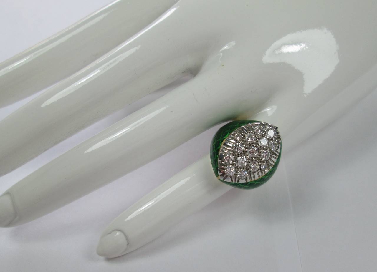 Designed with a marquise bombe shaped diamond cluster, within a chessboard green enamel setting.

Mounted in 18Kt yellow and white gold

Finger size: 6 1/2 

Weight: 16.8 gr