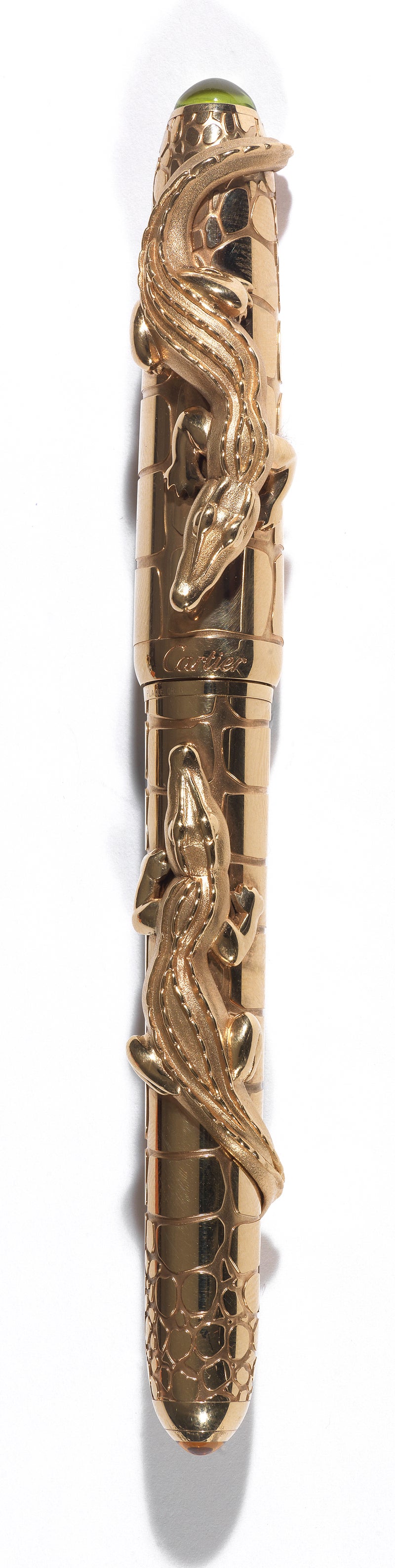 PLEASE NOTE: OUR PRICE IS FULLY INCLUSIVE OF SHIPPING, IMPORTATION TAXES & DUTIES.

This exceptional gold-plated fountain pen depicts two exquisitely wrought crocodiles atop a barrel textured after crocodile hide. The pen is set with brilliant