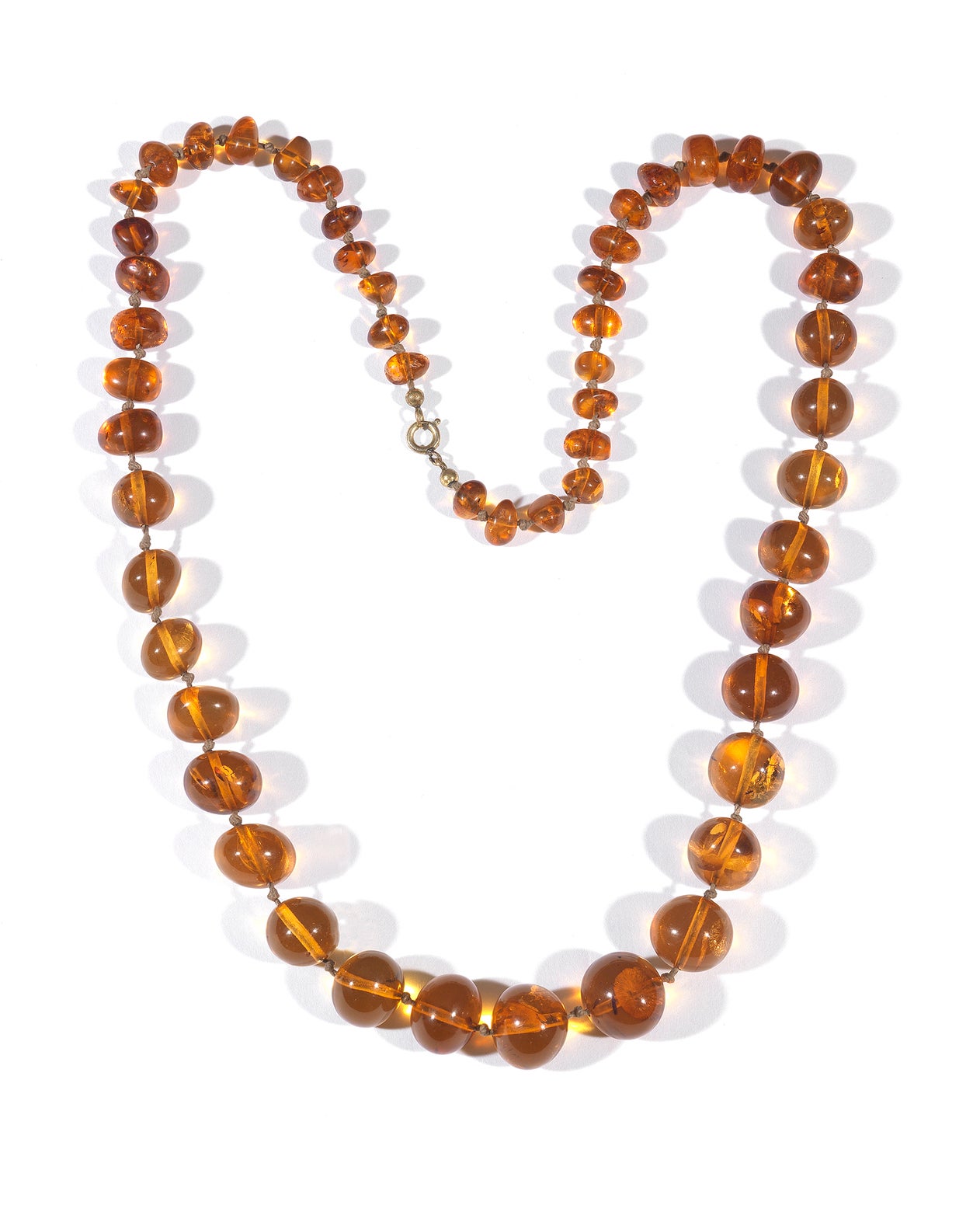 SHIPPING POLICY:
No additional costs will be added to this order.
Shipping costs will be totally covered by the seller (customs duties included). 

Composed of a continuous single strand of graduated round and oval amber beads, ranging from 8 mm to