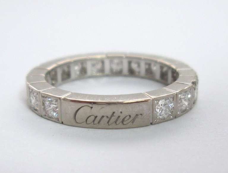 Composed of a line of channel-set 17 brilliant-cut diamonds weighing approximately 0.85 cts to polished borders, finger size 50.

Signed Cartier with maker's mark, no. NT 0812

Weight 4.4 gr

PLEASE NOTE: OUR PRICE IS FULLY INCLUSIVE OF