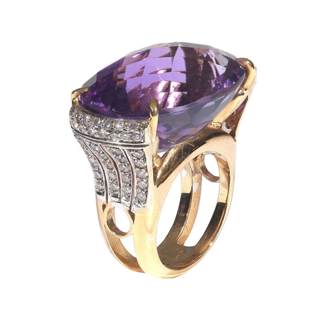 

The oval mixed-cut amethyst claw-set in a mount pave'-set with brilliant-cut diamonds.

Size 7.