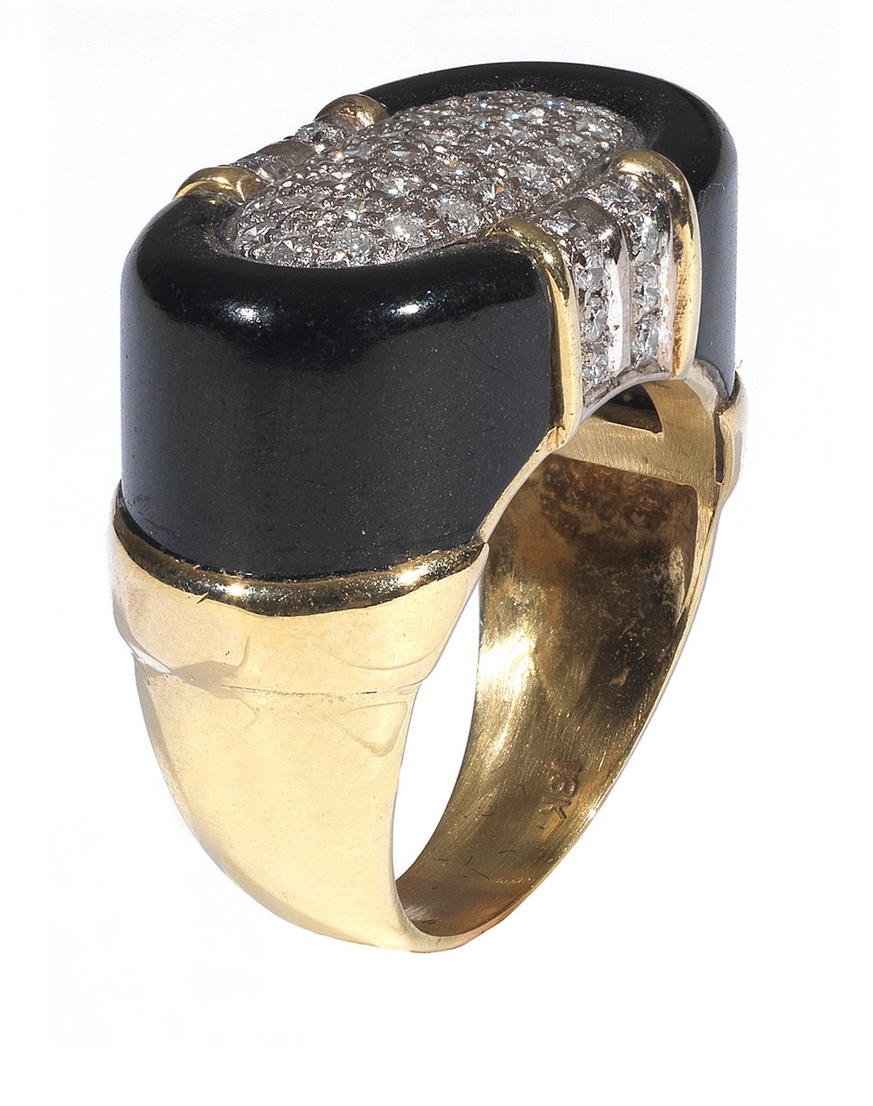 
Of architectural design, the ring mounted with a central panel of pavé-set circular-cut diamond to the onyx sides

Size 7