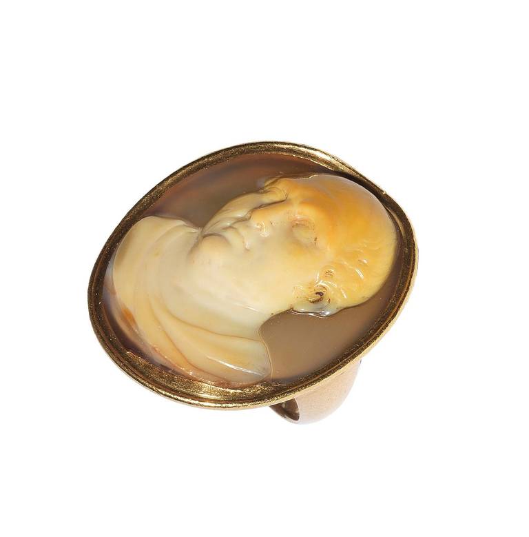 Oval, depicting the bust of Cicero, turning slightly to the left, wearing a draped toga, in a gold mount, gold infill to cameo at base, ring size K-L, length 26mm, width 21mm

The great Roman statesman Marcus Tullius Cicero (106BC-43BC) was an