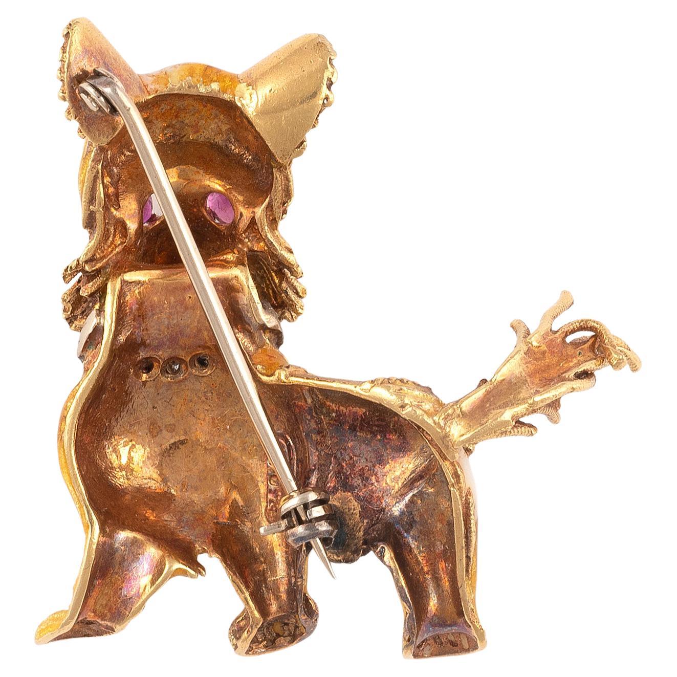 
Designed as an 18 carat yellow gold dog with a single-cut diamond collar, the eyes set with circular-cut ruby and the yellow and white guilloché enamel body with textured and polished detail,length 5.2cm