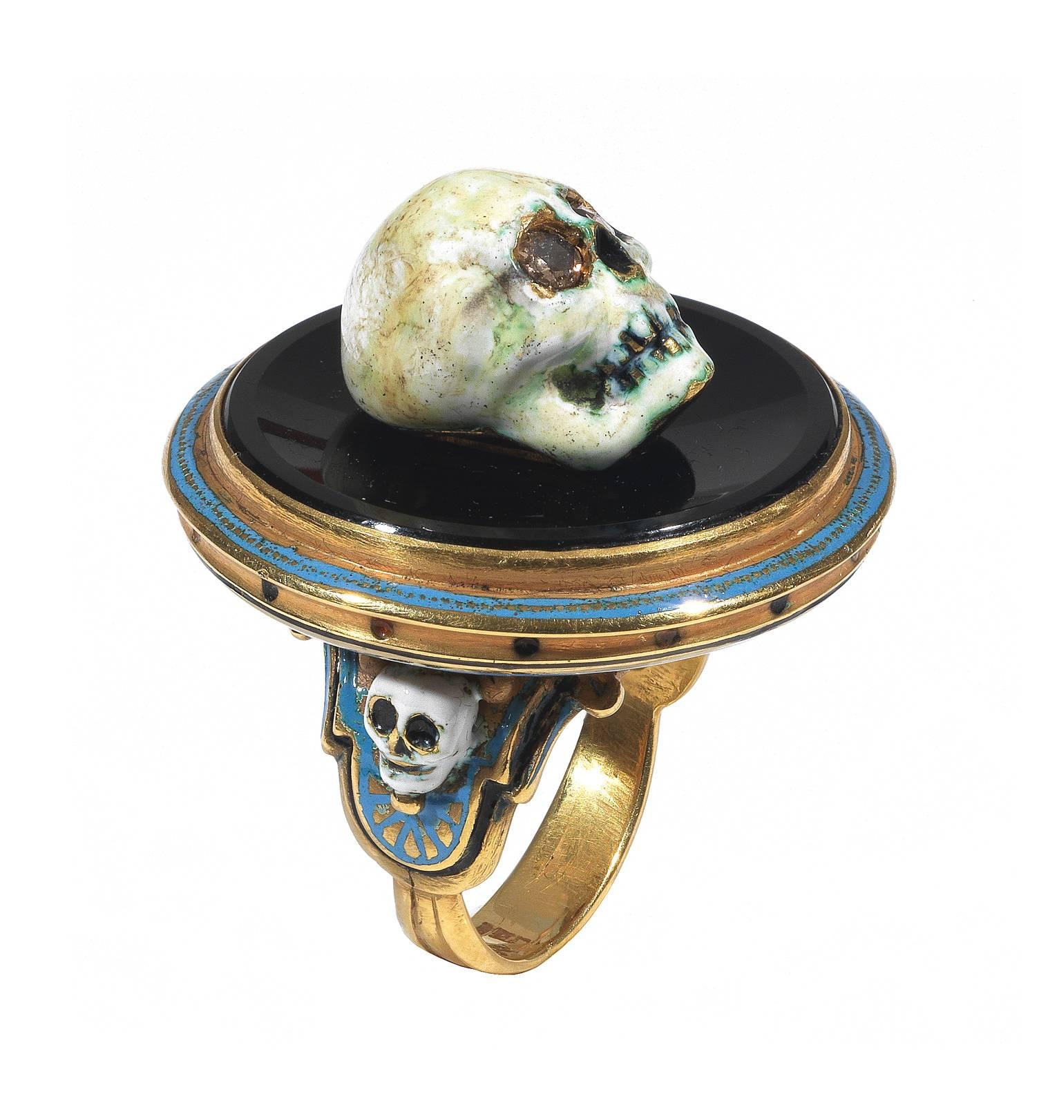 

Renaissance style Memento Mori skull ring made with champleve multicolored enamels, a round onyx, and rose cut diamonds

Mounted in 18Kt gold

Signed A. Codognato Venezia

Weight: 34 gr

Finger size: 7  

