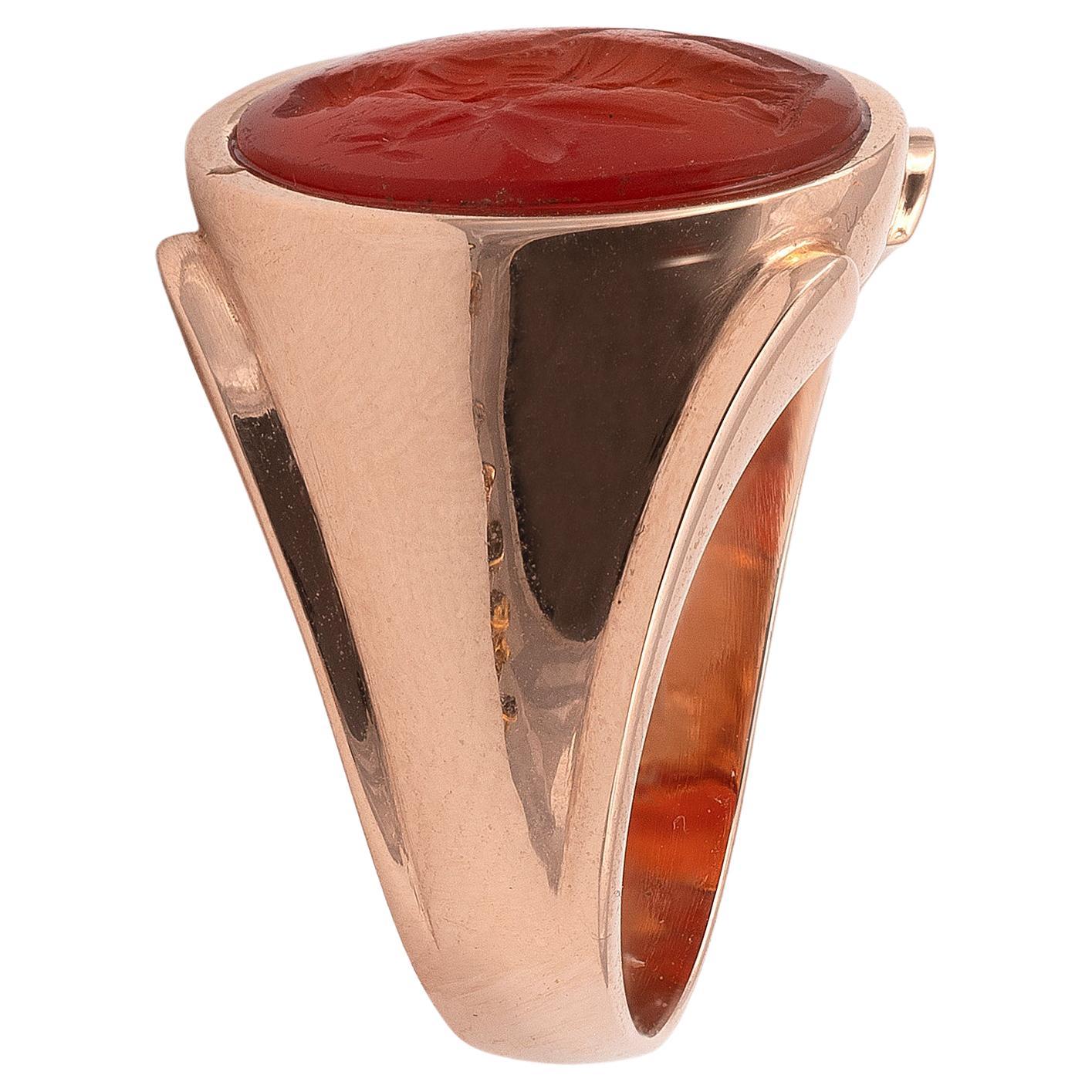 

The oval carnelian intaglio , finely engraved with an image of the goddess of wisdom and war, Minerva, who is depicted standing wearing a helmet and holding a spear and shield, set in a modern gold ring, finger size 7, 
14mm length of intaglio