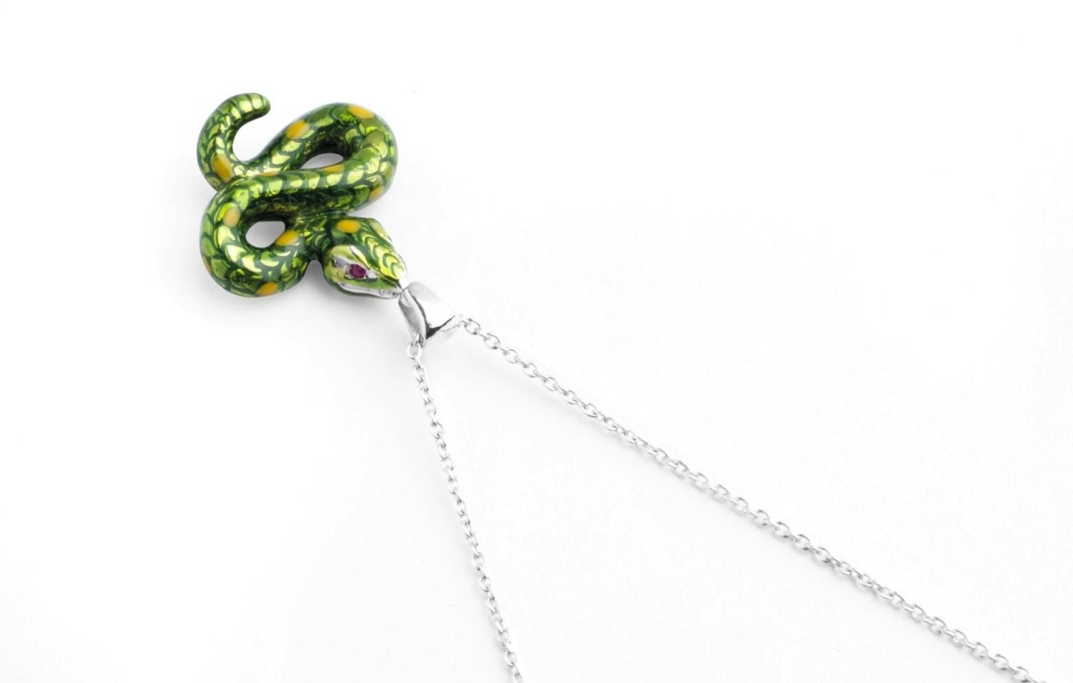 

The sterling silver snake pendant has a green enamel finish and is fitted on to a 15