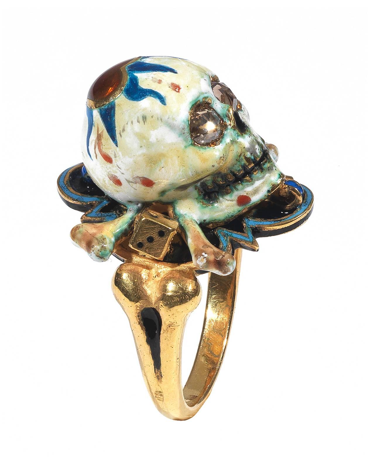 

Renaissance style Memento Mori skull ring made with champleve multicolored enamels and rose cut diamonds eyes.

Mounted in 18Kt gold

Signed A. Codognato

Weight: 21.1 gr

Finger size: 7

