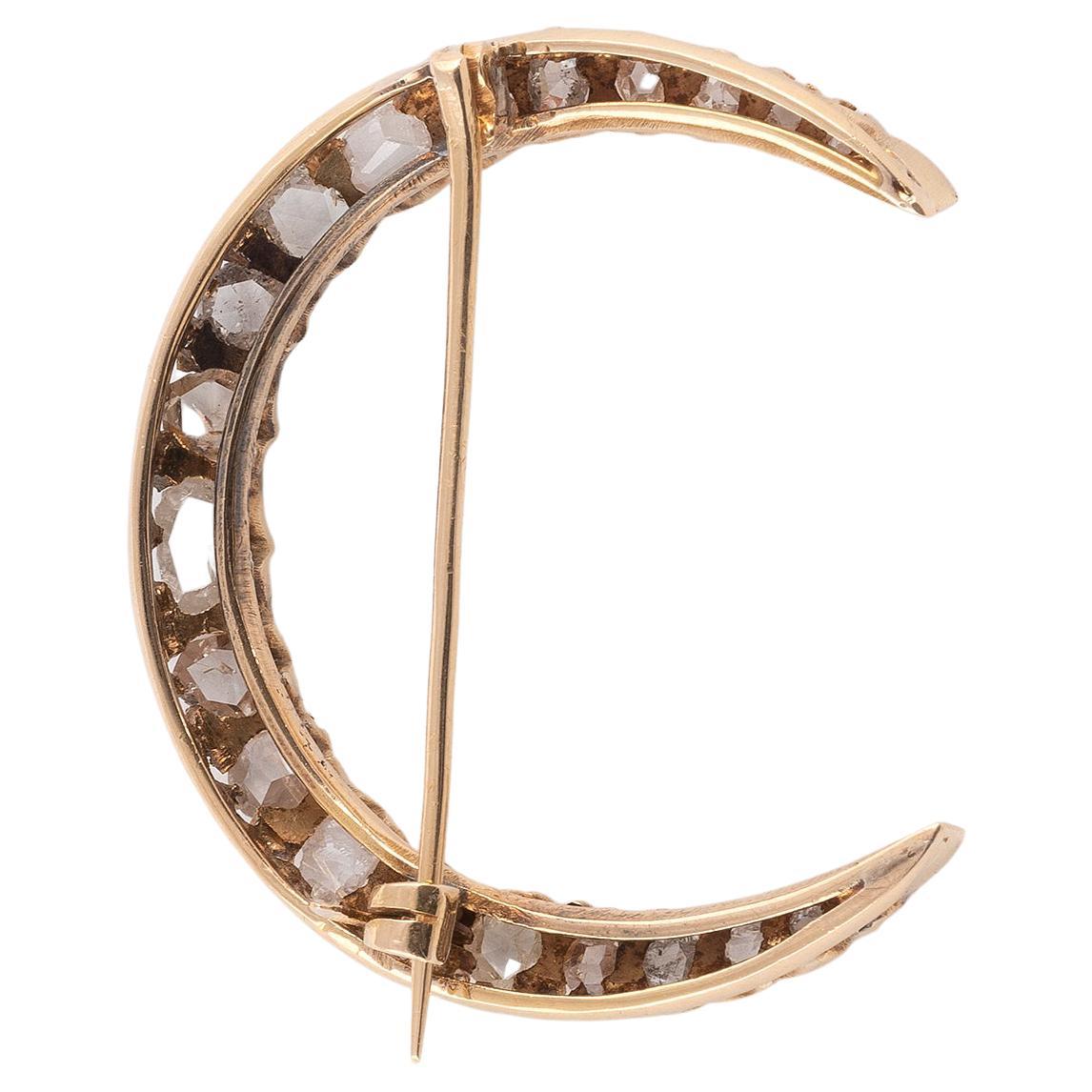 
The crescent moon plaque set throughout with rose diamonds approximately 2.00 carat total, mounted in gold, length 3.8cm