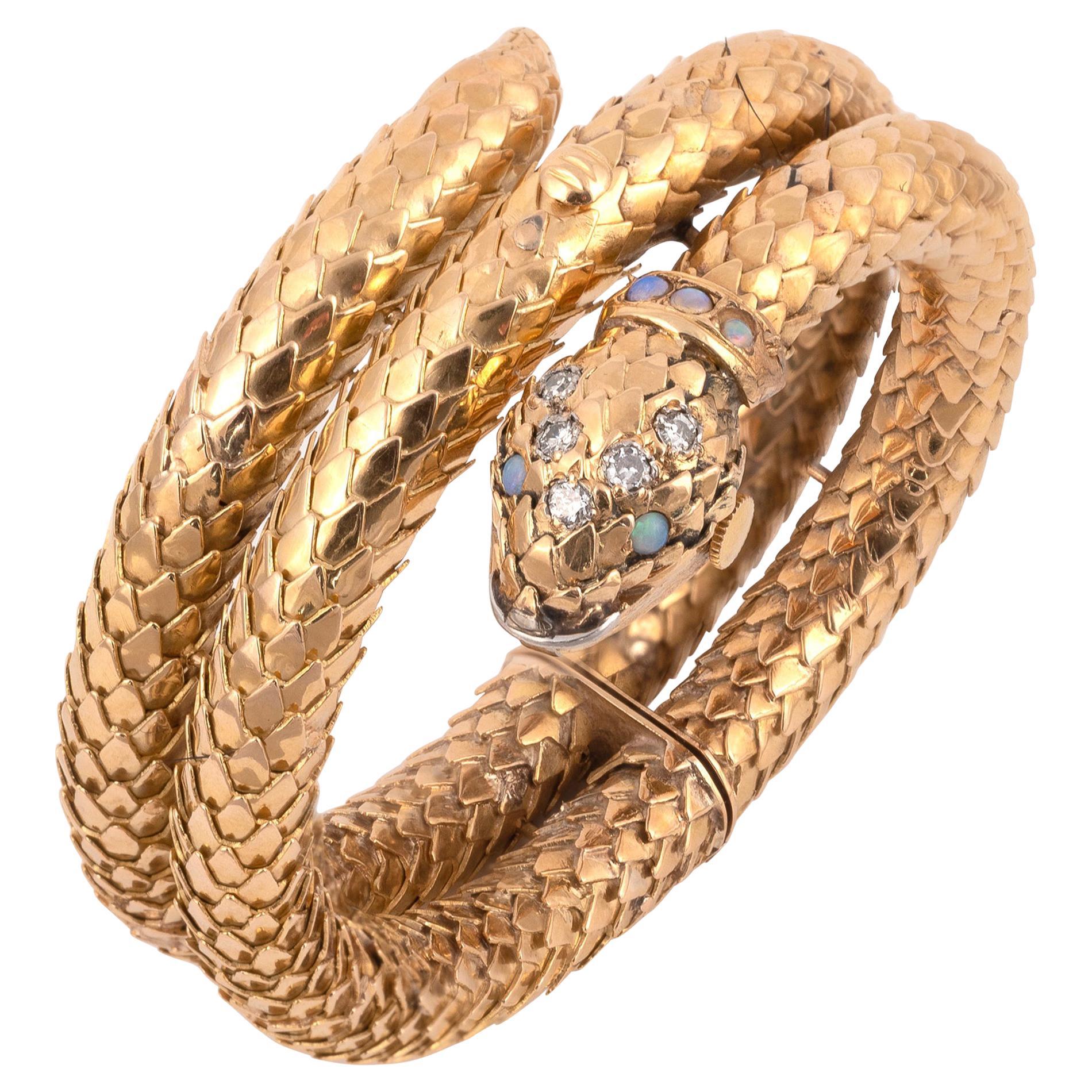 Montre à cadran couvert et bracelet serpent en or jaune 18 carats