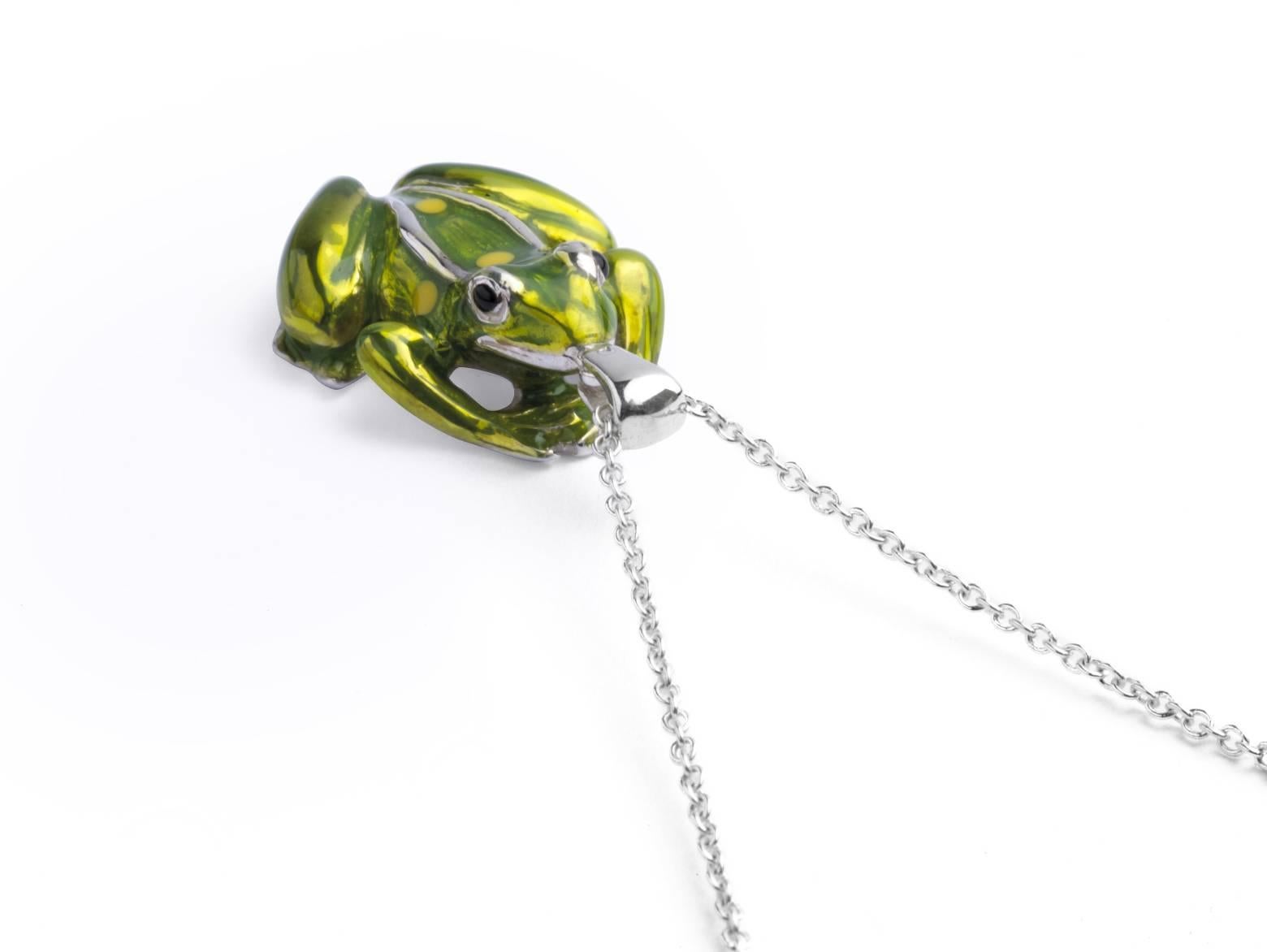 
The sterling silver frog pendant has a green enamel finish and is fitted on to a 15