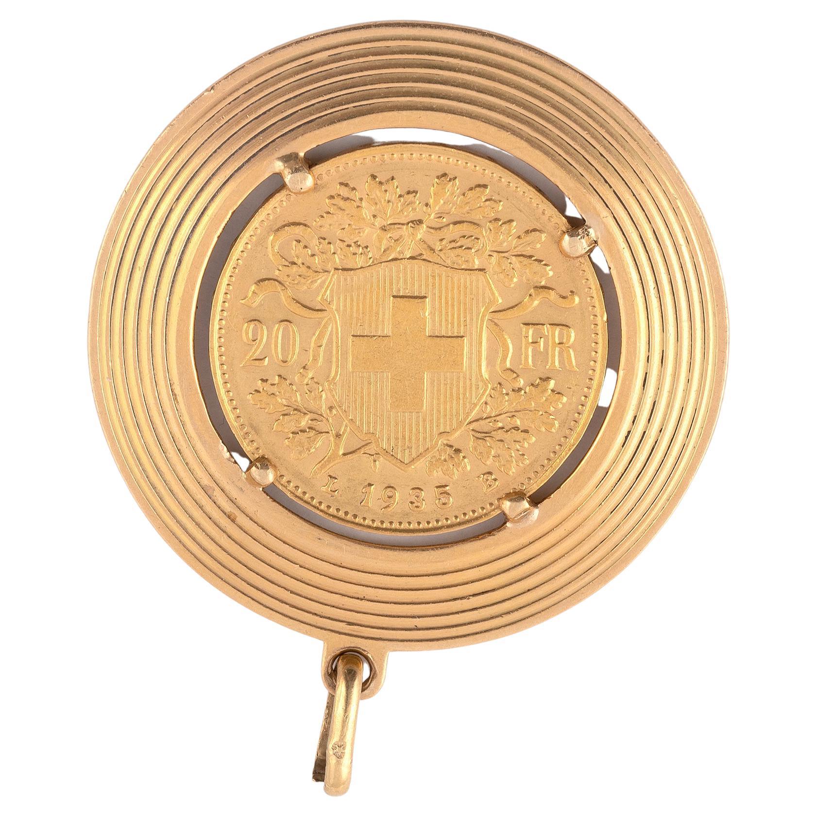 

Circular gold mount with Swiss 20 francs, 1935ca
Size: diameter 34mm
Weight: 13gr.