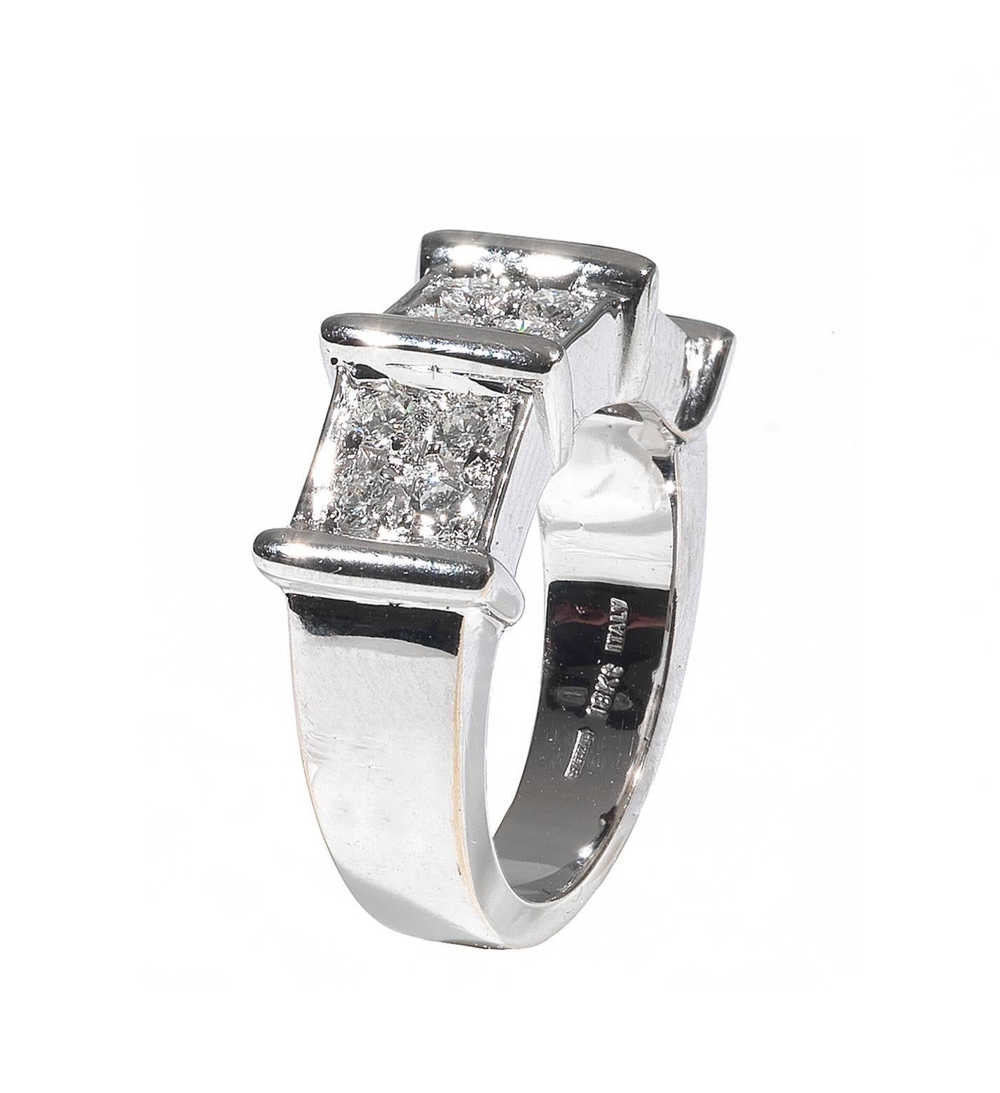 Designed as a band divided in three section set with claw set round cut diamonds

Mounted in 18Kt white gold

Finger size: 6 1/2

Weight: 11.3 gr
