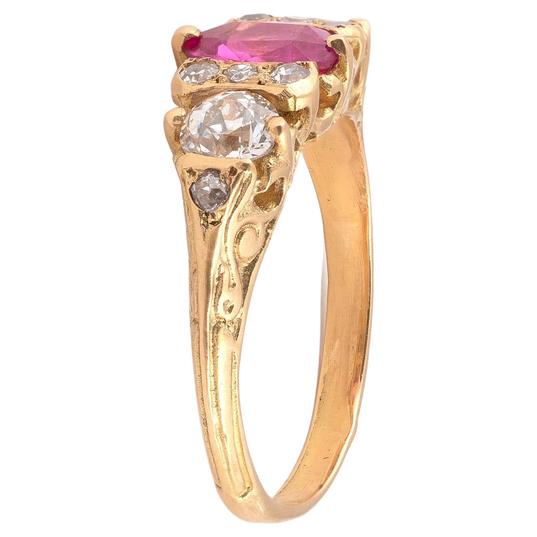 

18K  yellow gold centered with an oval pink sapphire shouldered by brilliant and old-cut diamonds. The ring partially engraved with volutes decorated with a small old cut diamond.
Maker's mark.
Finger size: 6 
Gross weight: 3.88 g 