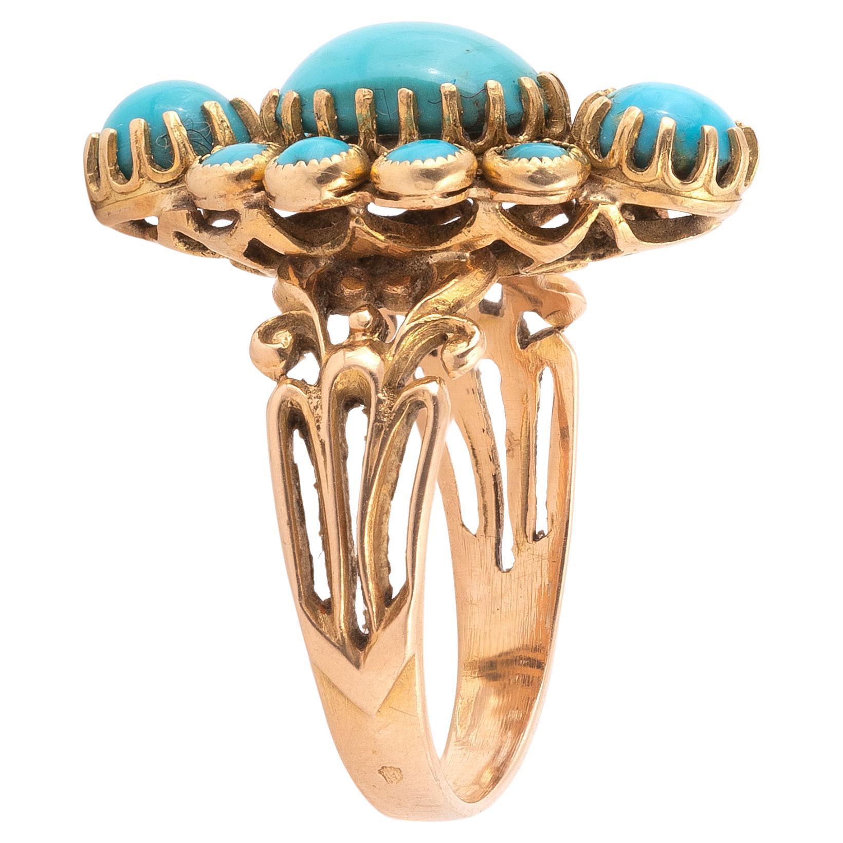 
A turquoises and yellow gold ring in the shape form with turquoise cabochons. Frame in worked 18K yellow gold. French work. Size 6 3/4. Gross weight: 5.98 gr
