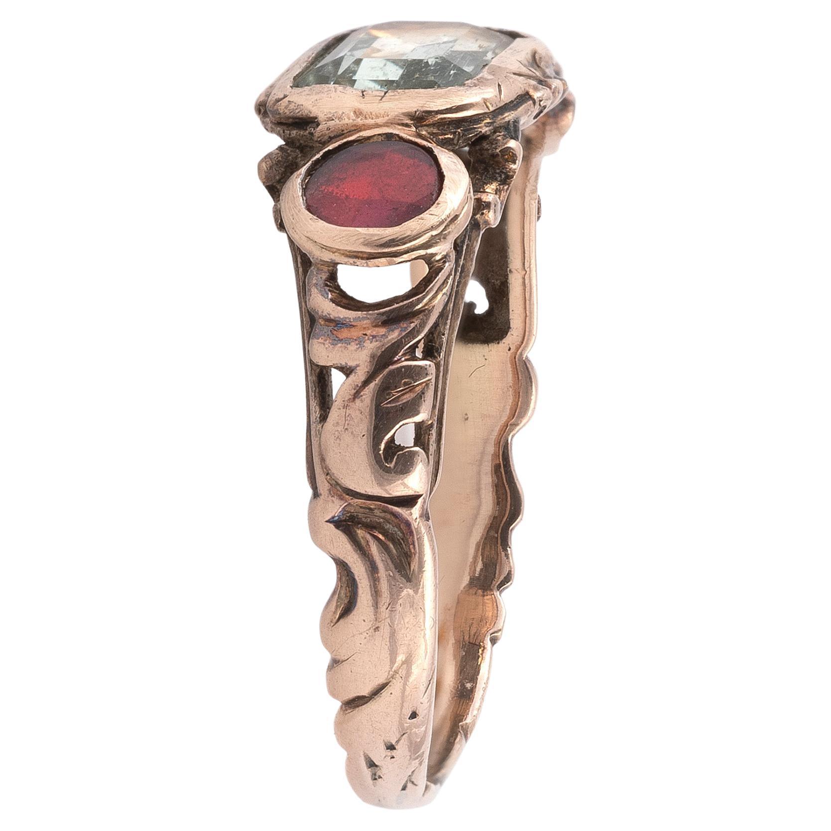 


Designed as the traditional Aretinian so called “Fede Chianina” with collet set garnet  and rock crystal table cut.

The term 