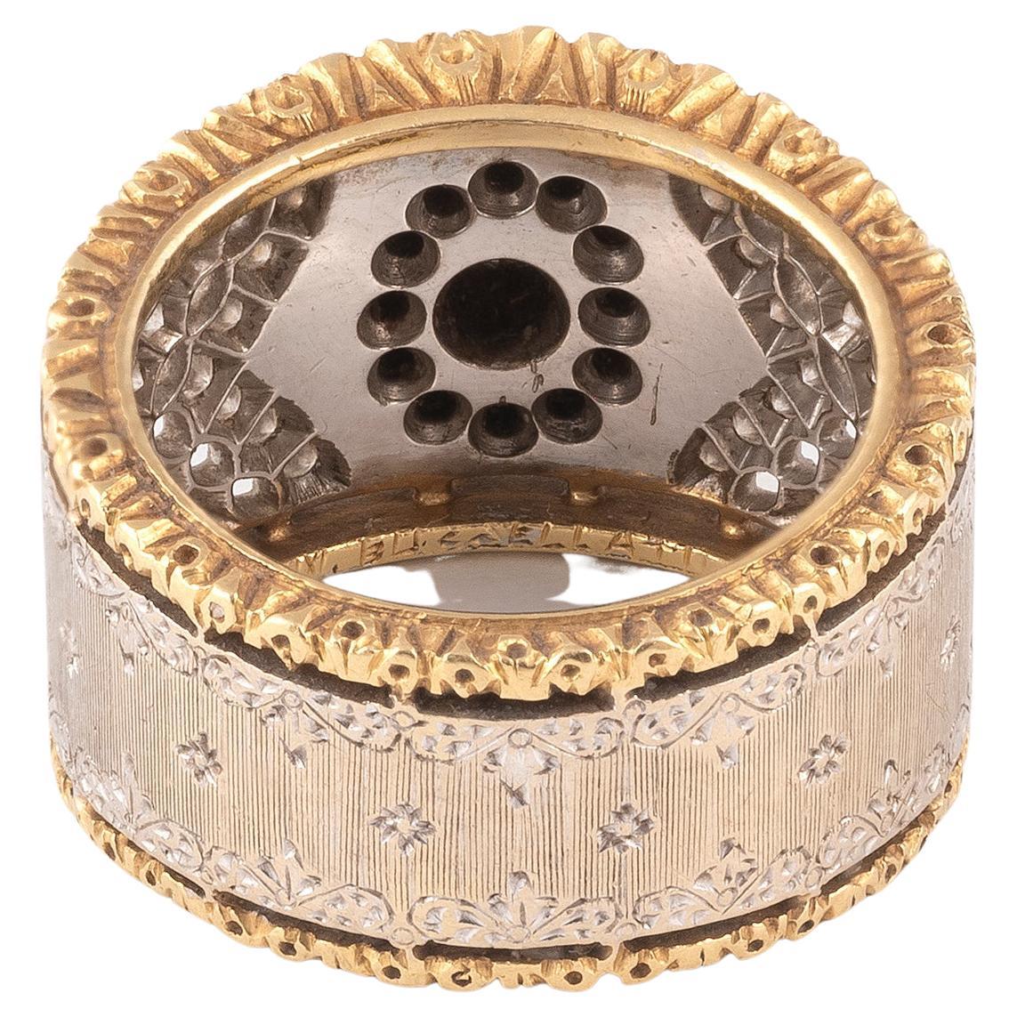 

Centering a round brilliant-cut diamond; signed Mario Buccellati; estimated total diamond weight: 0.70 carat; mounted in 18k bicolor gold; 
Size: 5 1/2
Weight: 12,30gr.