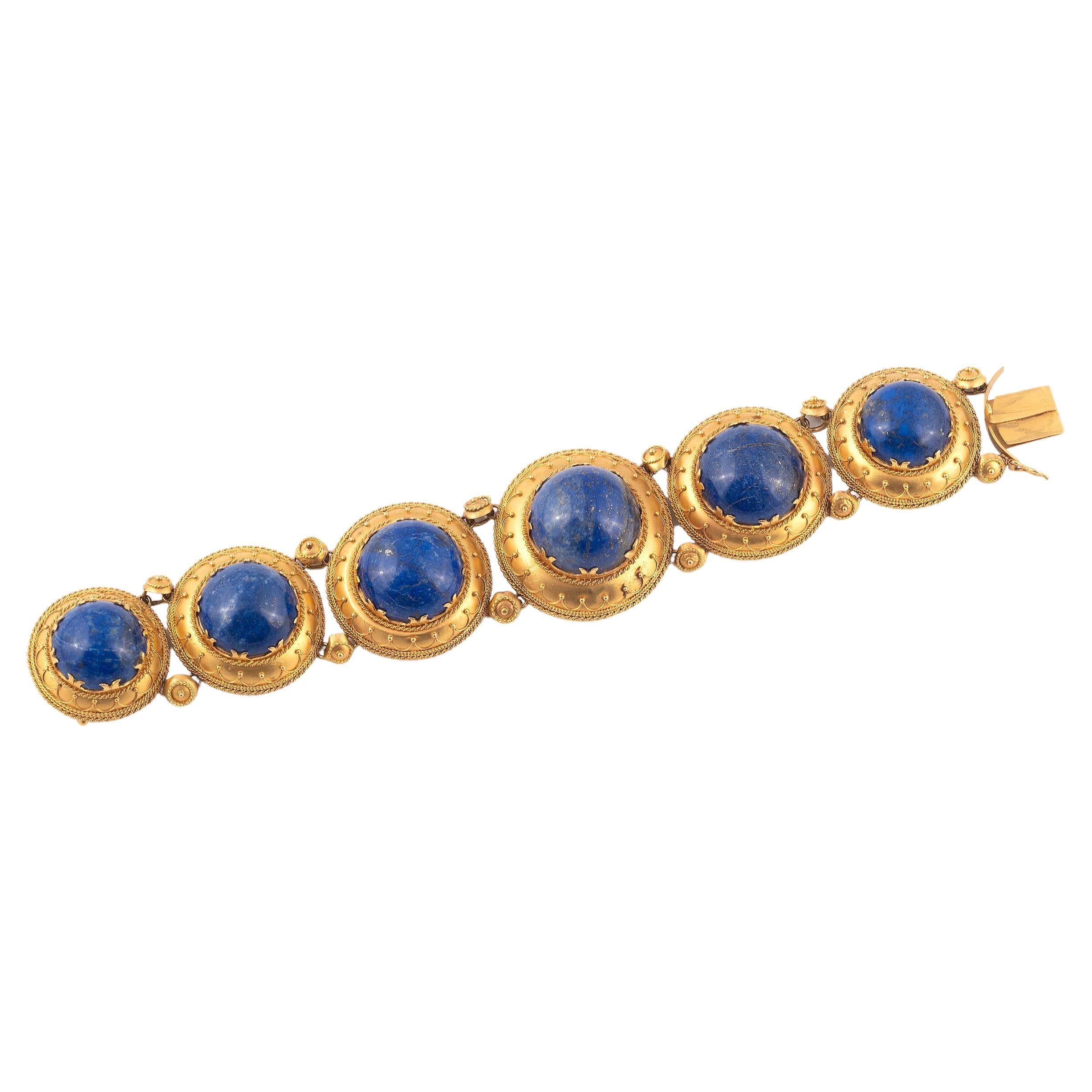 
Each Cabochon Lapis lazuli plaque within a rope twist surround.
Length 16,7cm
Weight: 39gr.